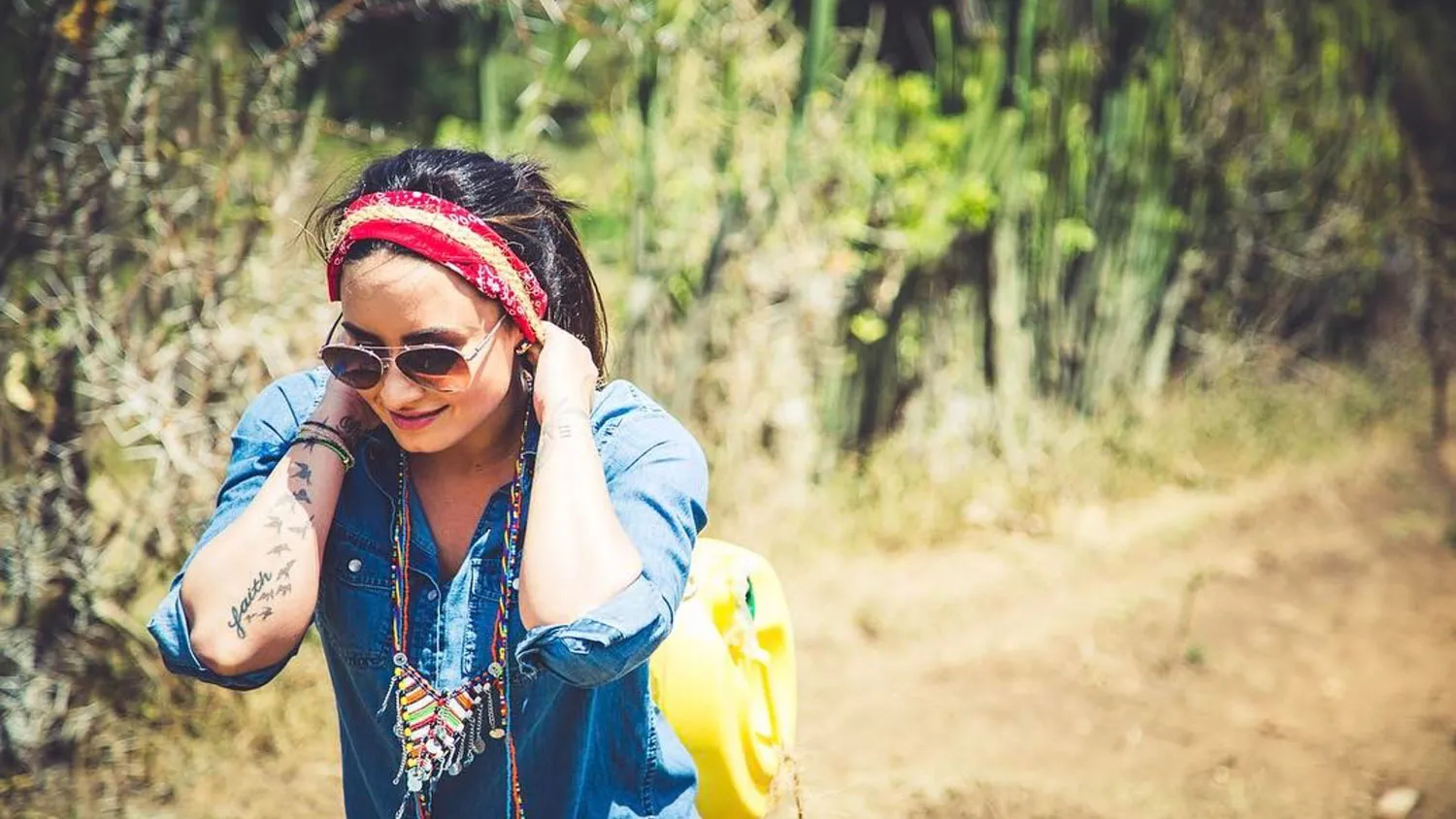 a woman with a bandana on her head