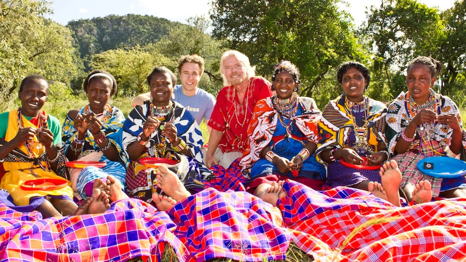 a group of people sitting around each other