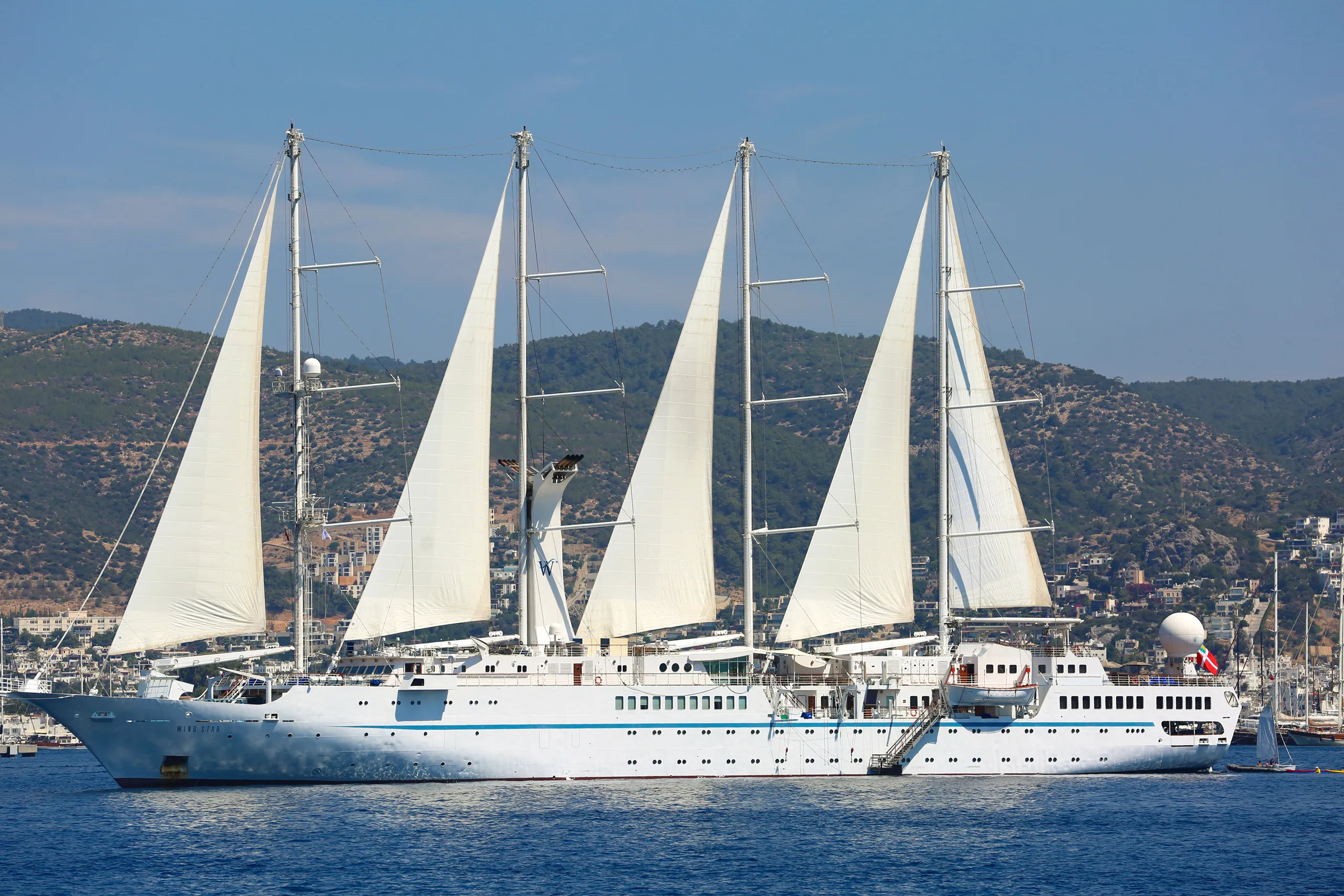 A Windstar sailing ship under full sail at sea