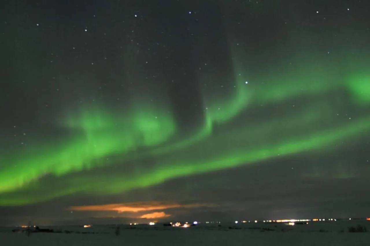 The northern lights over the horizon in Iceland