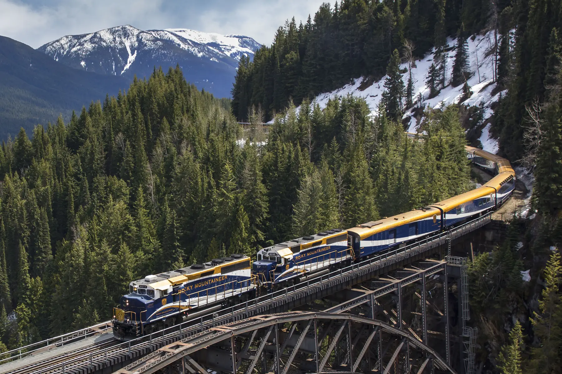 A train crossing the Stoney Creek Bridge trestle in the British Columbia mountains