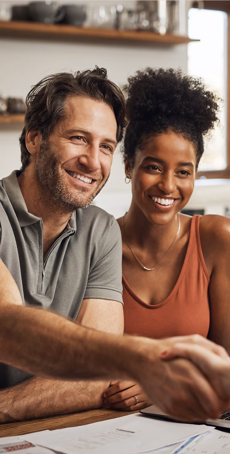 homebuyers making a deal at kitchen counter