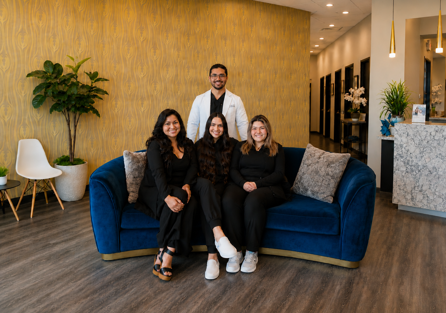 Dr. Karnik Shah and the Comfydent Smiles team in the practice reception area.