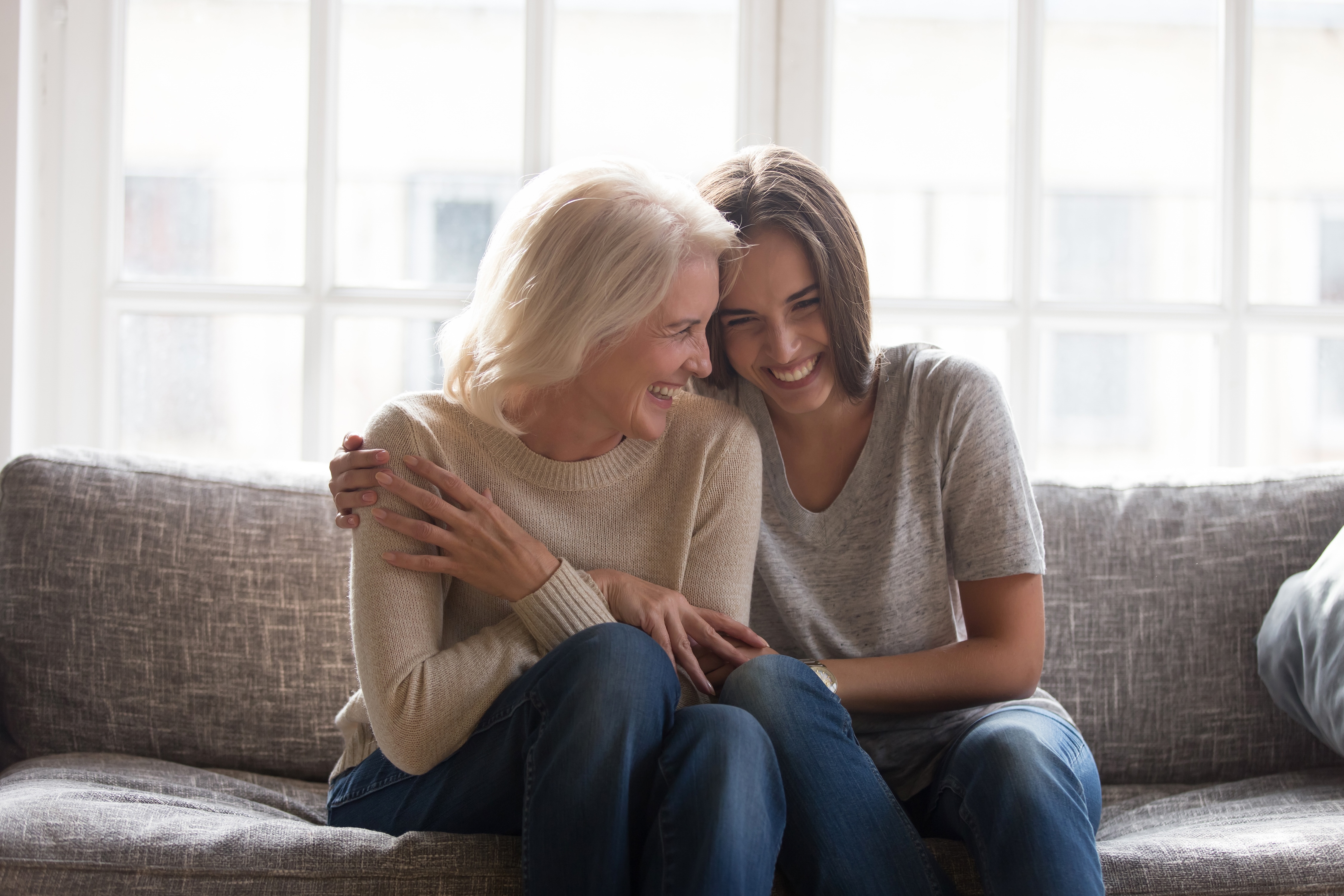 Two women hugging each other stock iamge