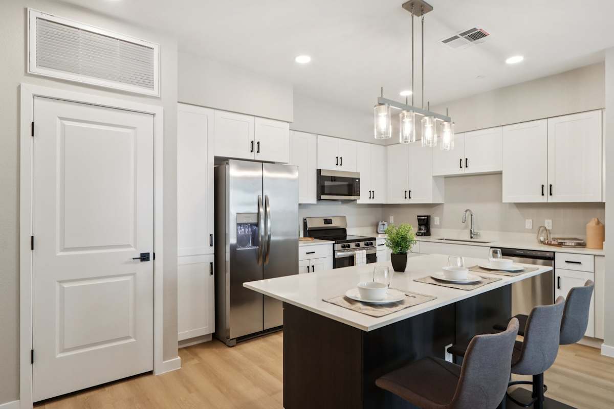 Kitchen with brown cabinets and stainless steel appliances