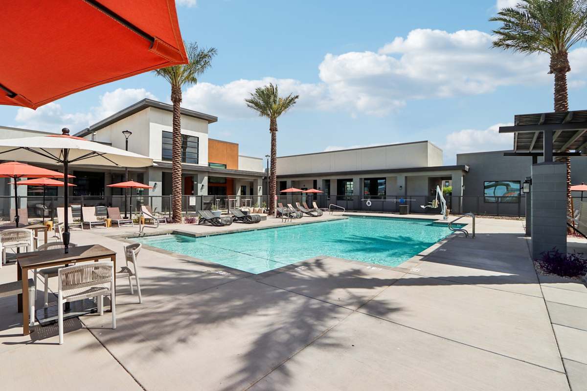Swimming Pool with view of umbrella and lounge chairs