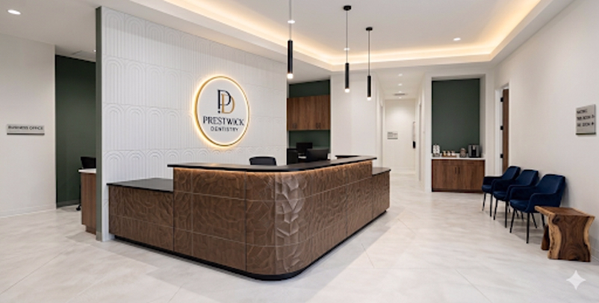 Modern dental office reception with wood textured desk, blue chairs, and hanging pendant lights.
