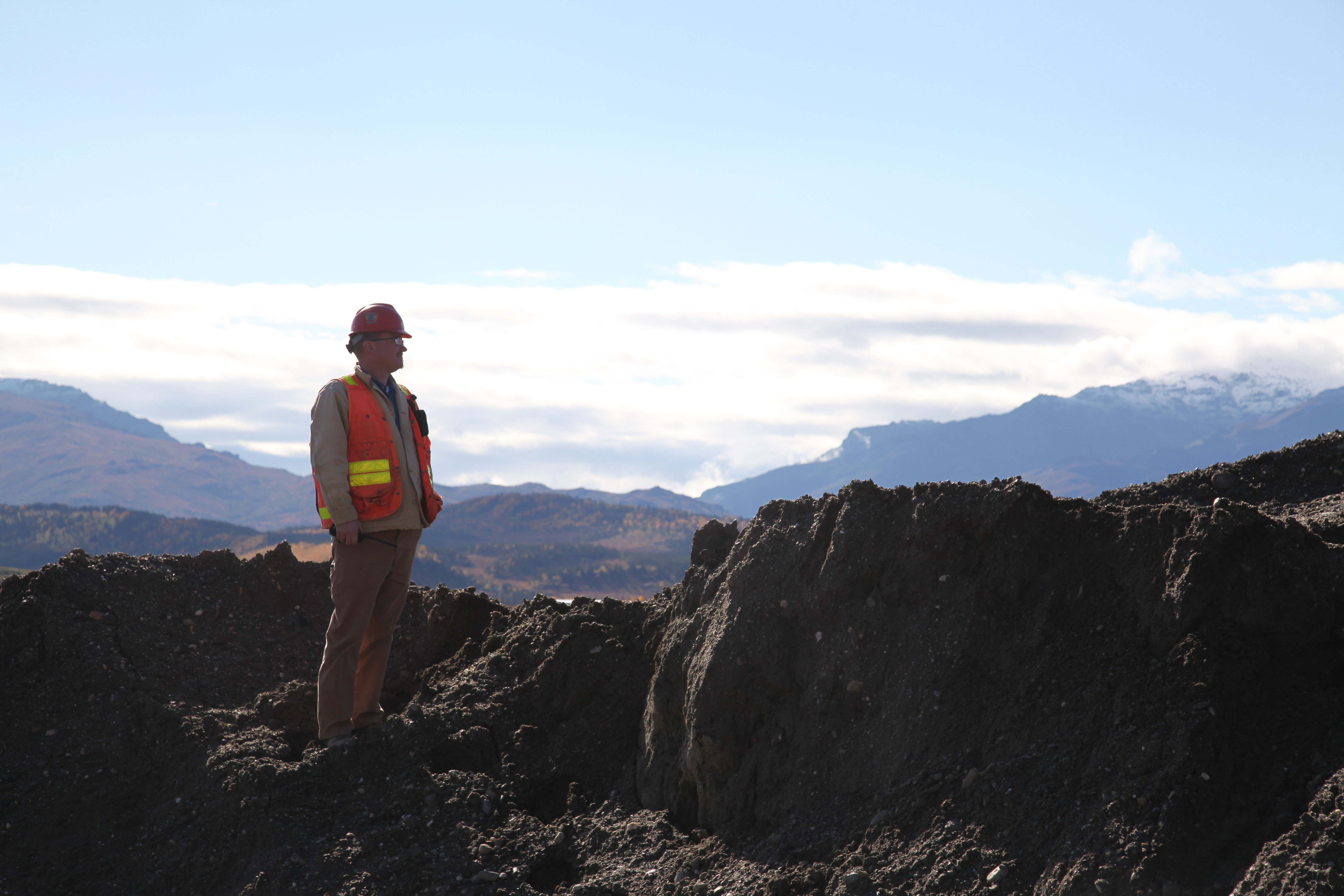 Mining engineer overlooking coal mining operations
