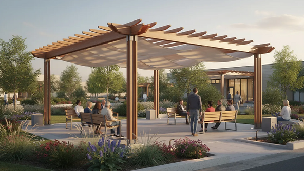 The image depicts a shaded outdoor fitness area featuring various exercise equipment, where community members are actively working out beneath fabric canopy structures. This well-maintained space encourages physical activity and community engagement, creating a welcoming environment for residents to enjoy active lifestyles together.