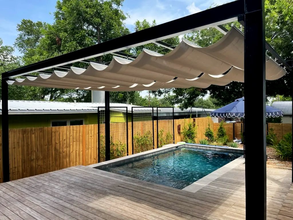 Two retractable shade panels deployed over the pool