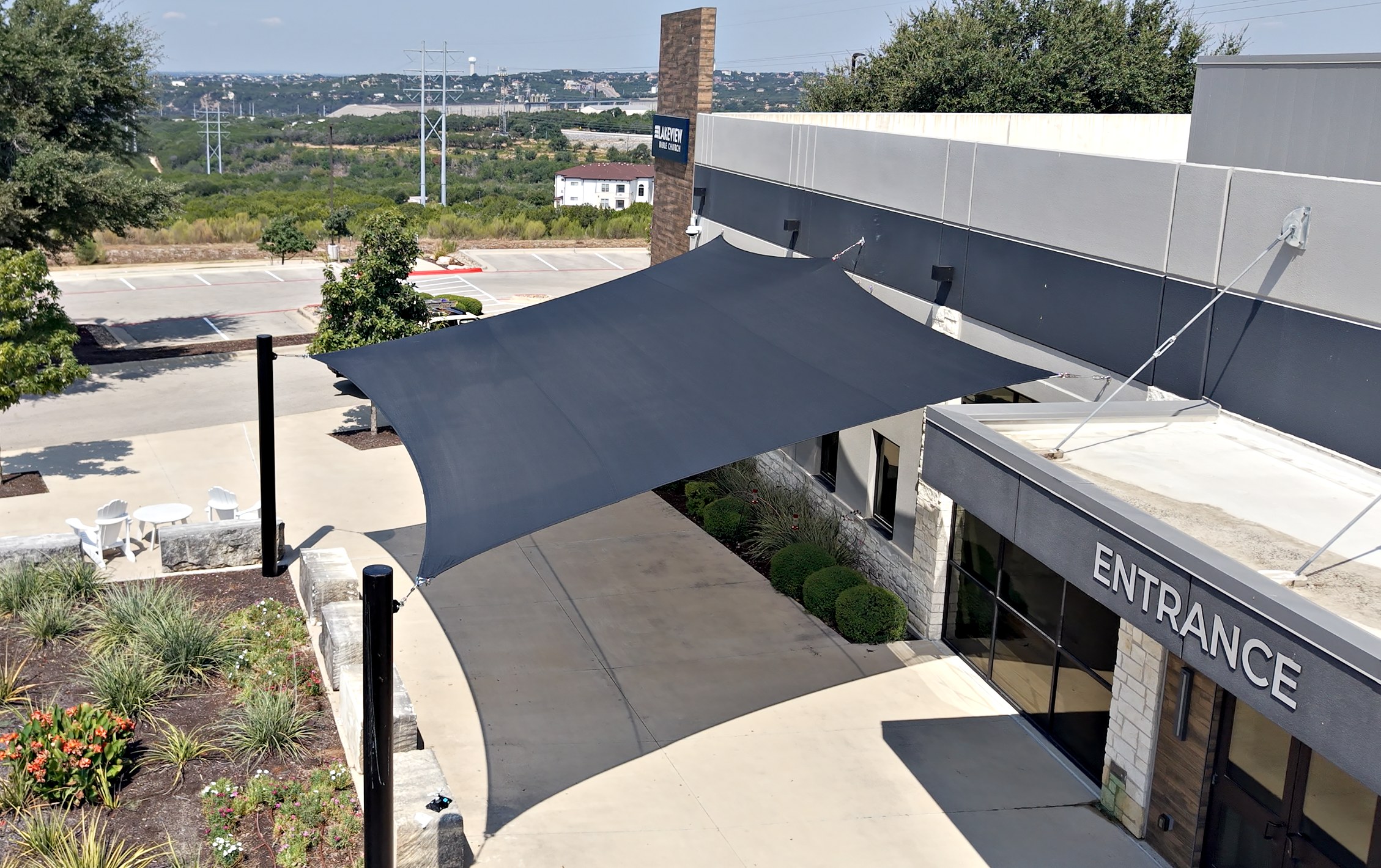 Aerial view of the charcoal five-point shade sail over the Lakeview Bible Church entrance