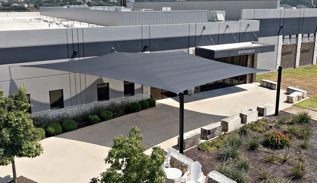 Drone view of the five-point sail spanning the church entry, patio, and landscaped beds