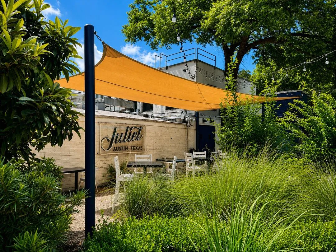 Yellow shade sail over the Juliet Italian Kitchen patio on Barton Springs Road