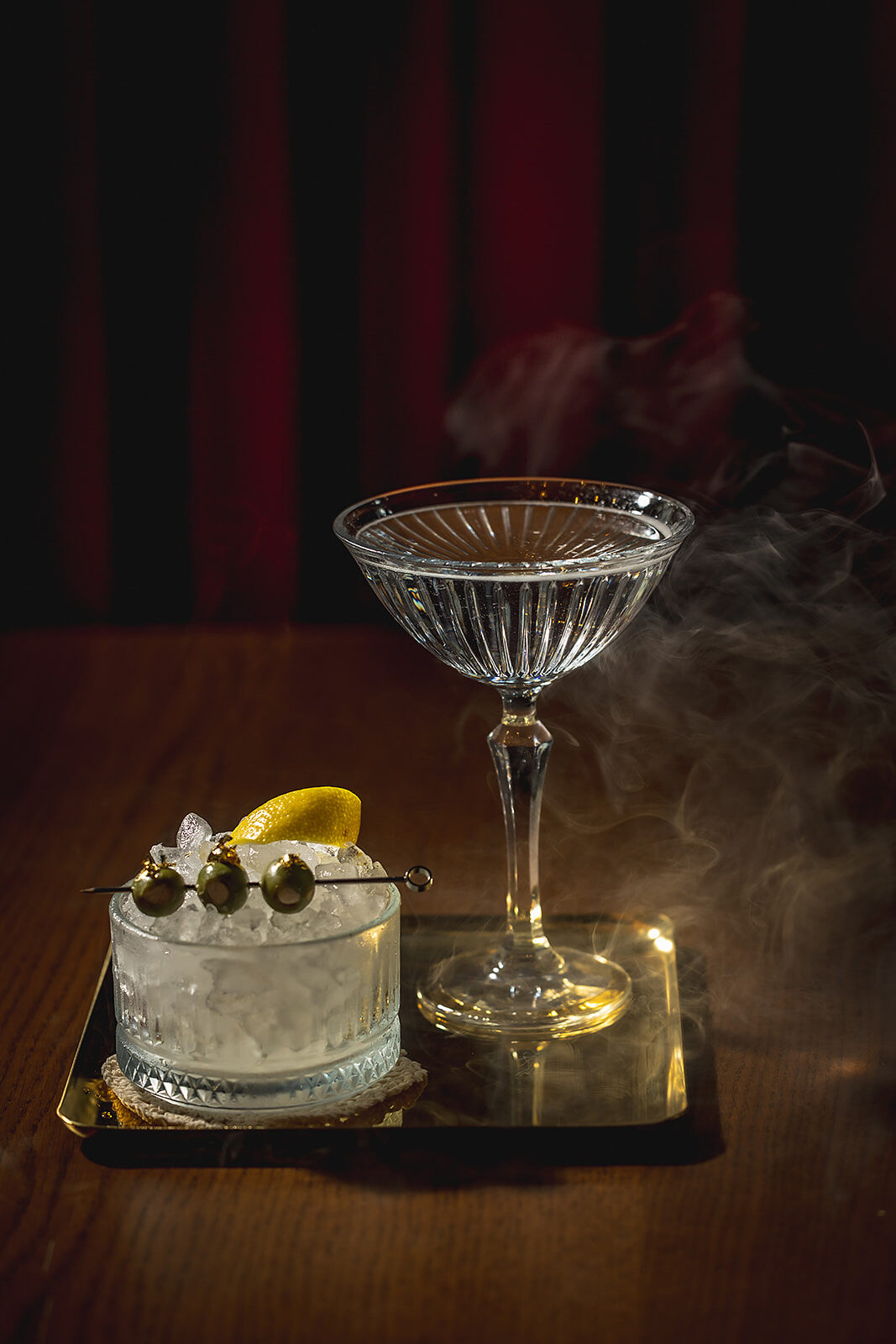 A smoking cocktail on a tray