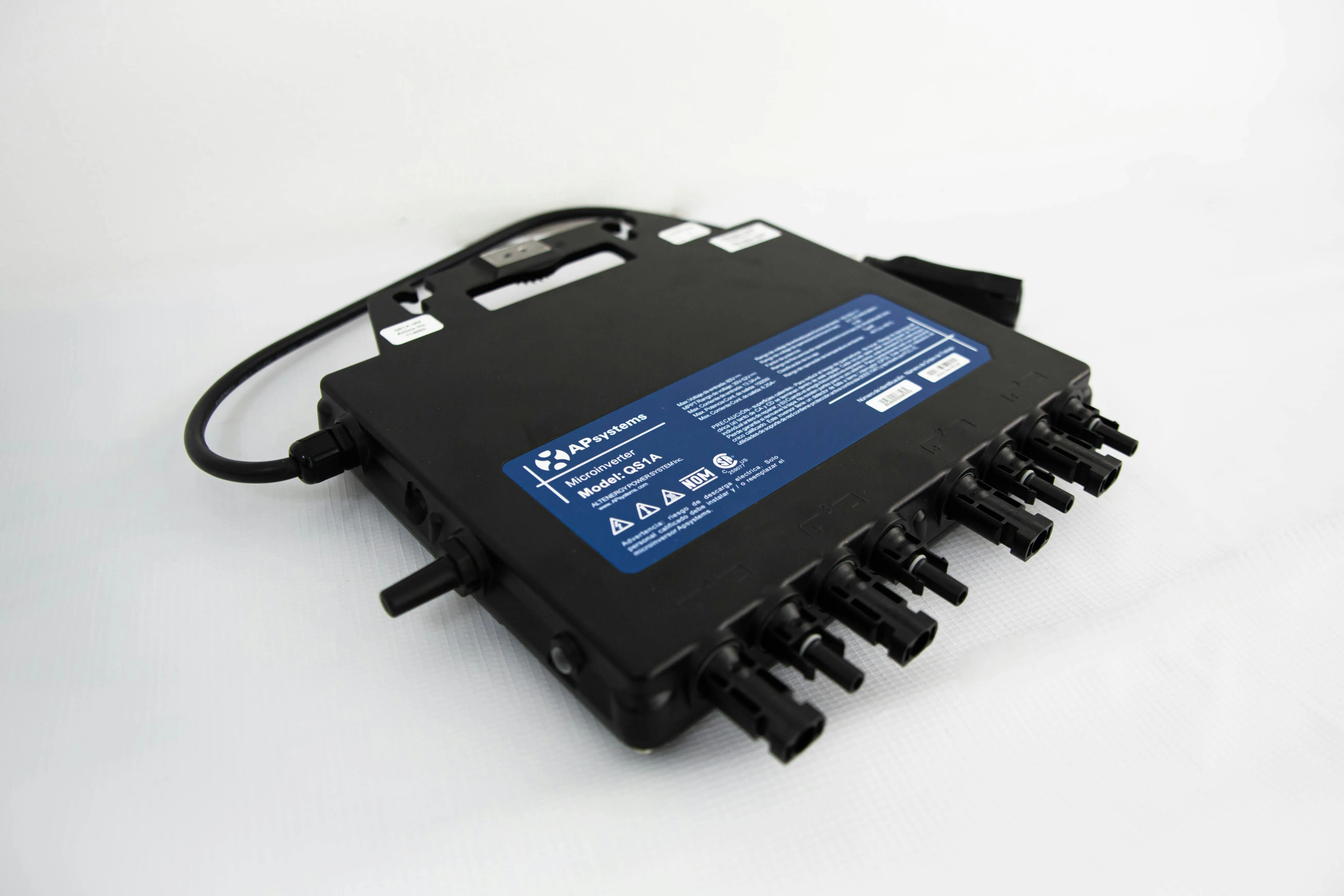 Black APsystems microinverter model QS1A with multiple cable connectors on white background.