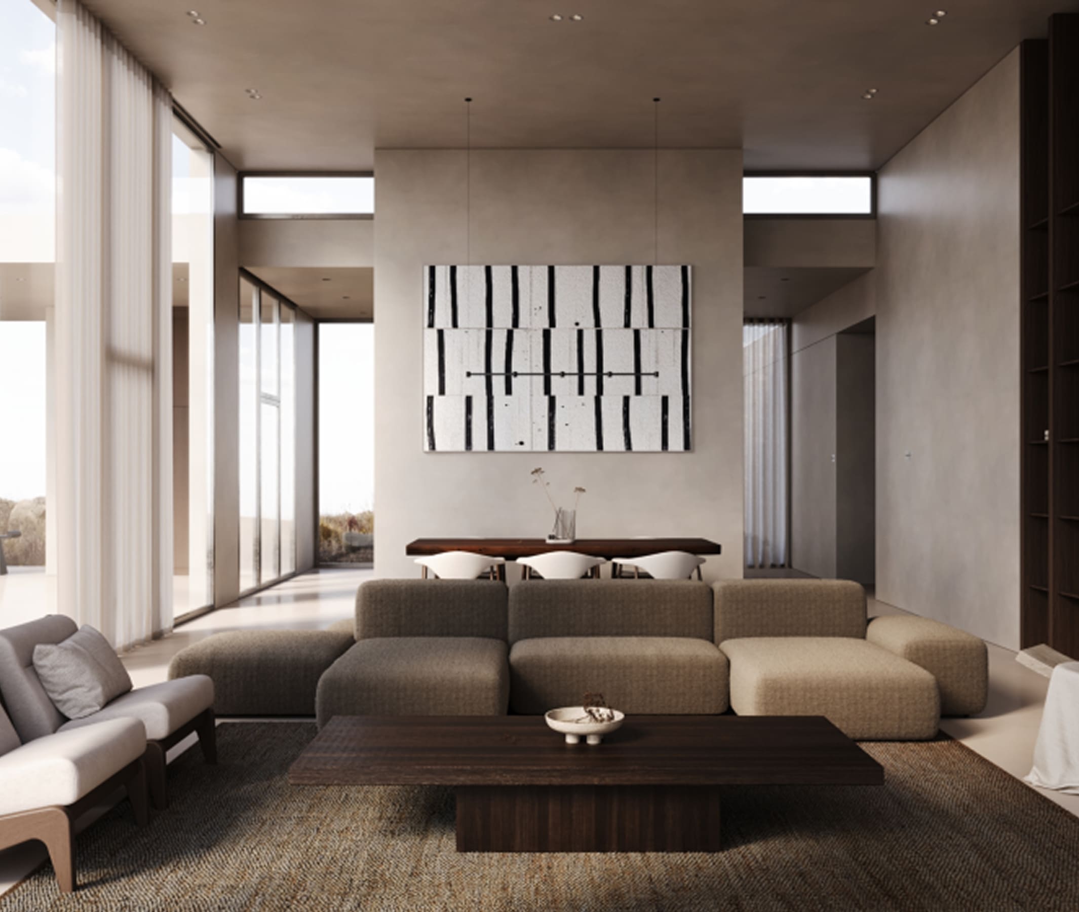 Modern living room with beige modular sofa, dark wood coffee table, and abstract black-and-white wall art.