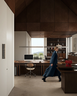 Modern office with wooden built-in shelves and desk, a computer on the desk, a red espresso machine on the counter, and a person walking past wearing a dark overcoat and hat.