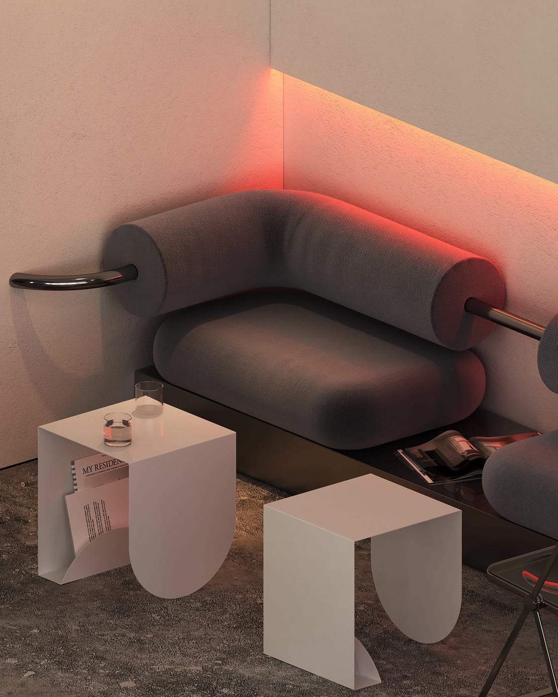 Modern corner seating area with a dark gray cushioned bench featuring cylindrical armrests with metal bars, illuminated by warm orange LED light along the wall, accompanied by two minimalist white side tables on a textured concrete floor, one table holding two glasses and papers titled 'MY RESIDENCE'.