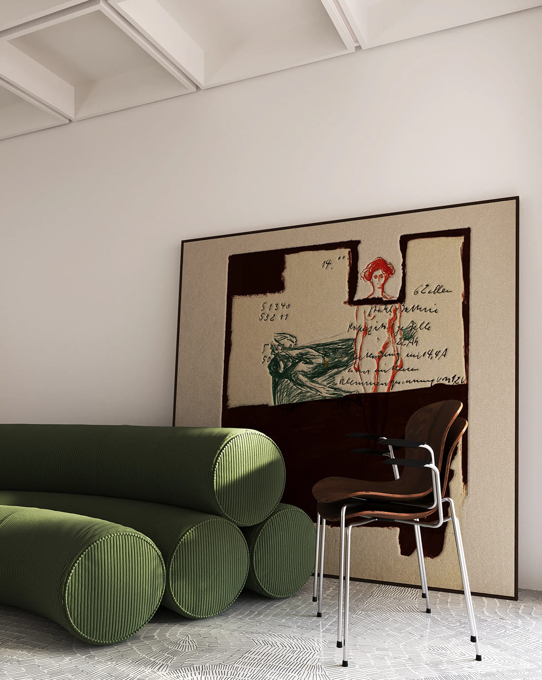 Interior scene with five green cylindrical cushions stacked in a pyramid shape on a patterned tile floor, a brown chair with metal legs beside them, and a large framed abstract artwork leaning against a white wall. The artwork features a red outline of a standing human figure and some handwritten text.