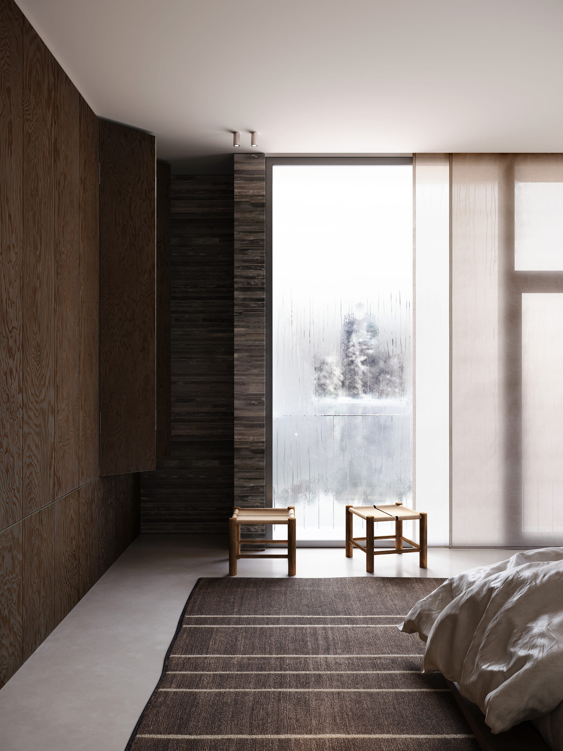 Modern spacious room with a large hanging spherical light, spiral staircase, and yoga mats on floor.