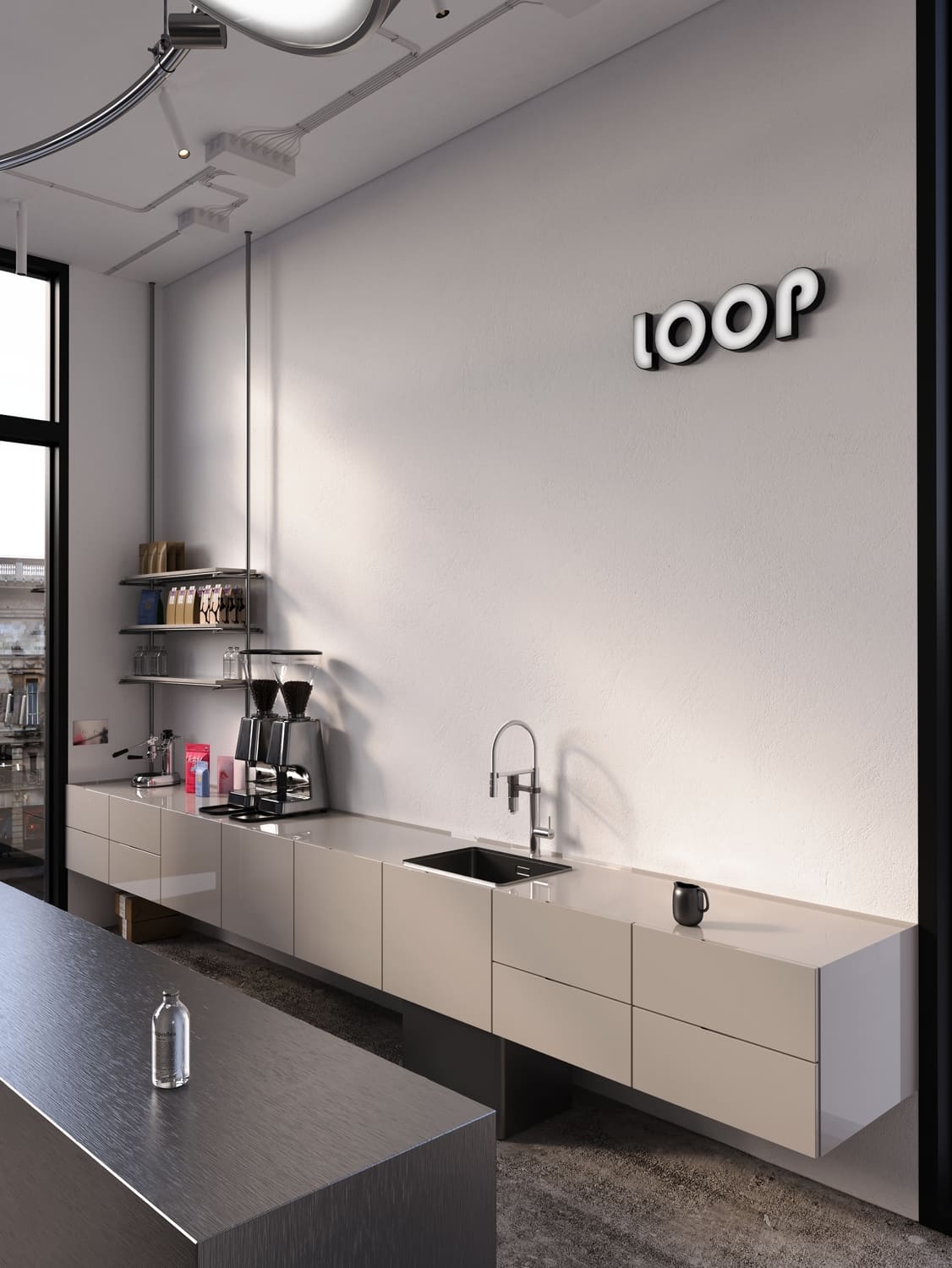 Minimalist coffee bar interior with a long beige wall-mounted cabinet, a black sink with modern faucet, coffee grinders, and shelves with coffee bags and glassware, under a neon sign reading 'loop'. A metal countertop table with a glass water bottle is in the foreground, and large windows let in daylight.
