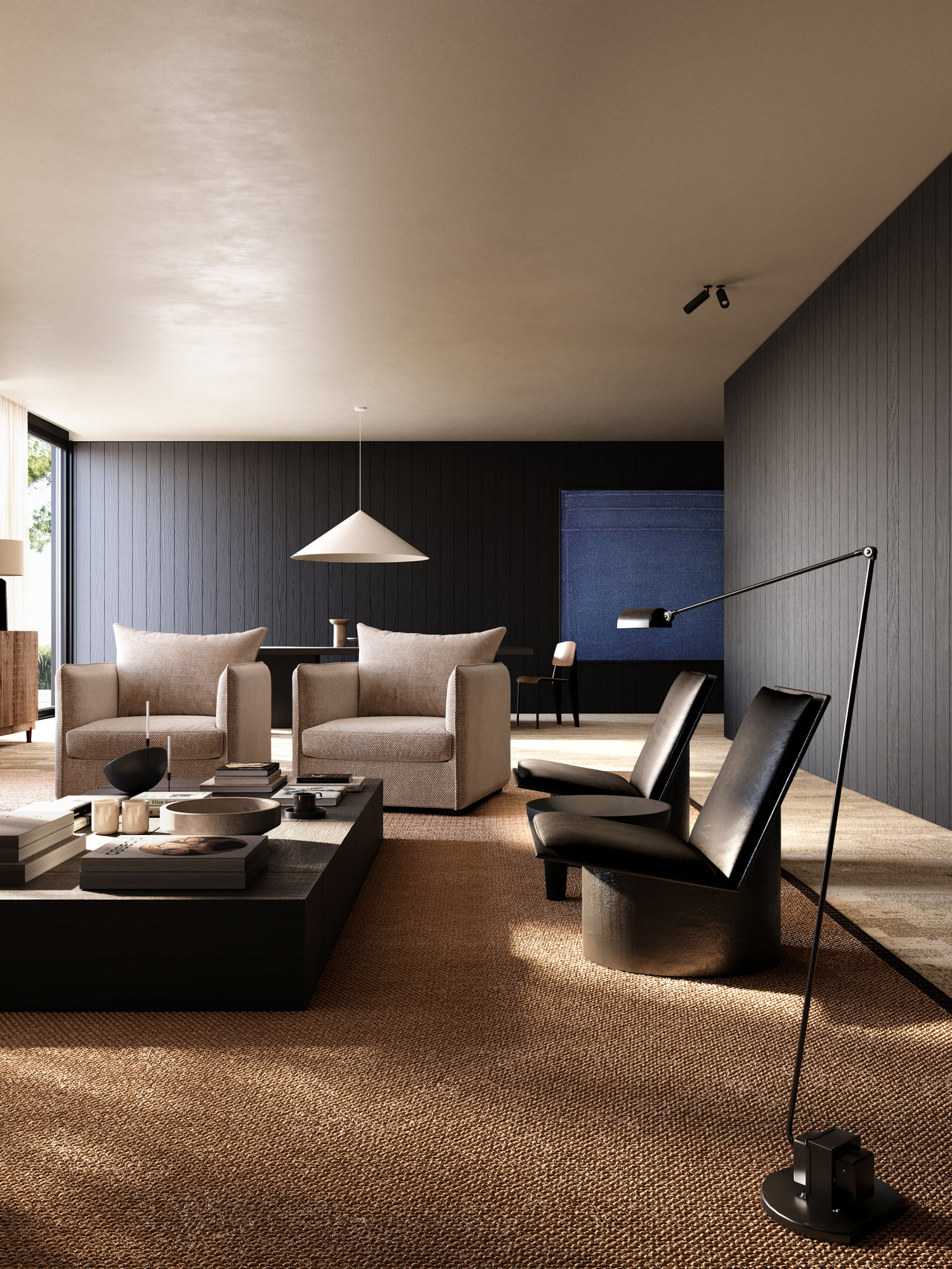Modern living room with two beige armchairs and two black leather chairs around a low black coffee table holding books and candles, set on a textured brown rug with dark wood-paneled walls and a minimalistic pendant light.