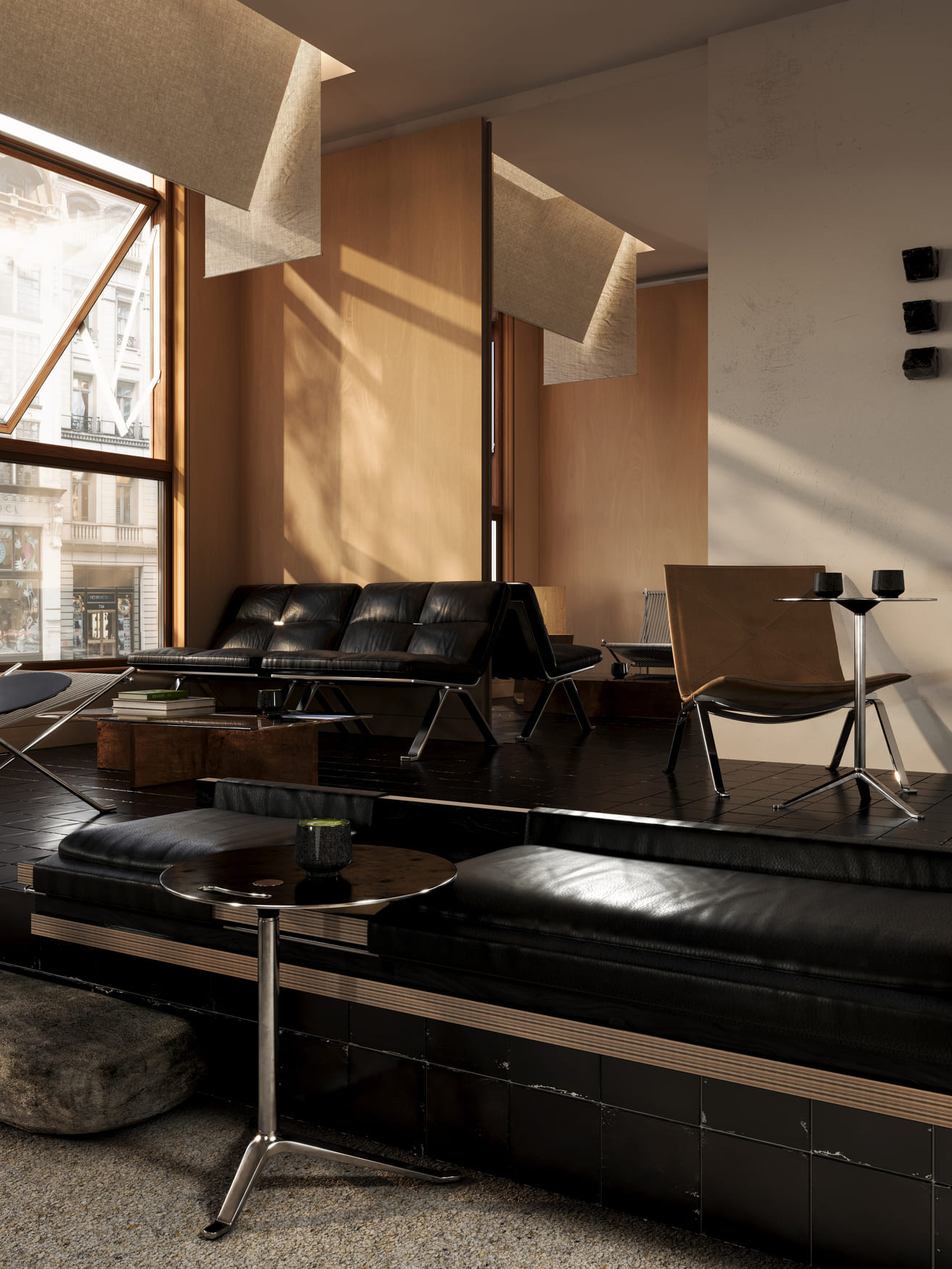 Modern interior lounge area with black leather couches, a brown chair, small round tables with black cups, large windows letting in natural light, and wood-paneled walls creating a warm atmosphere.