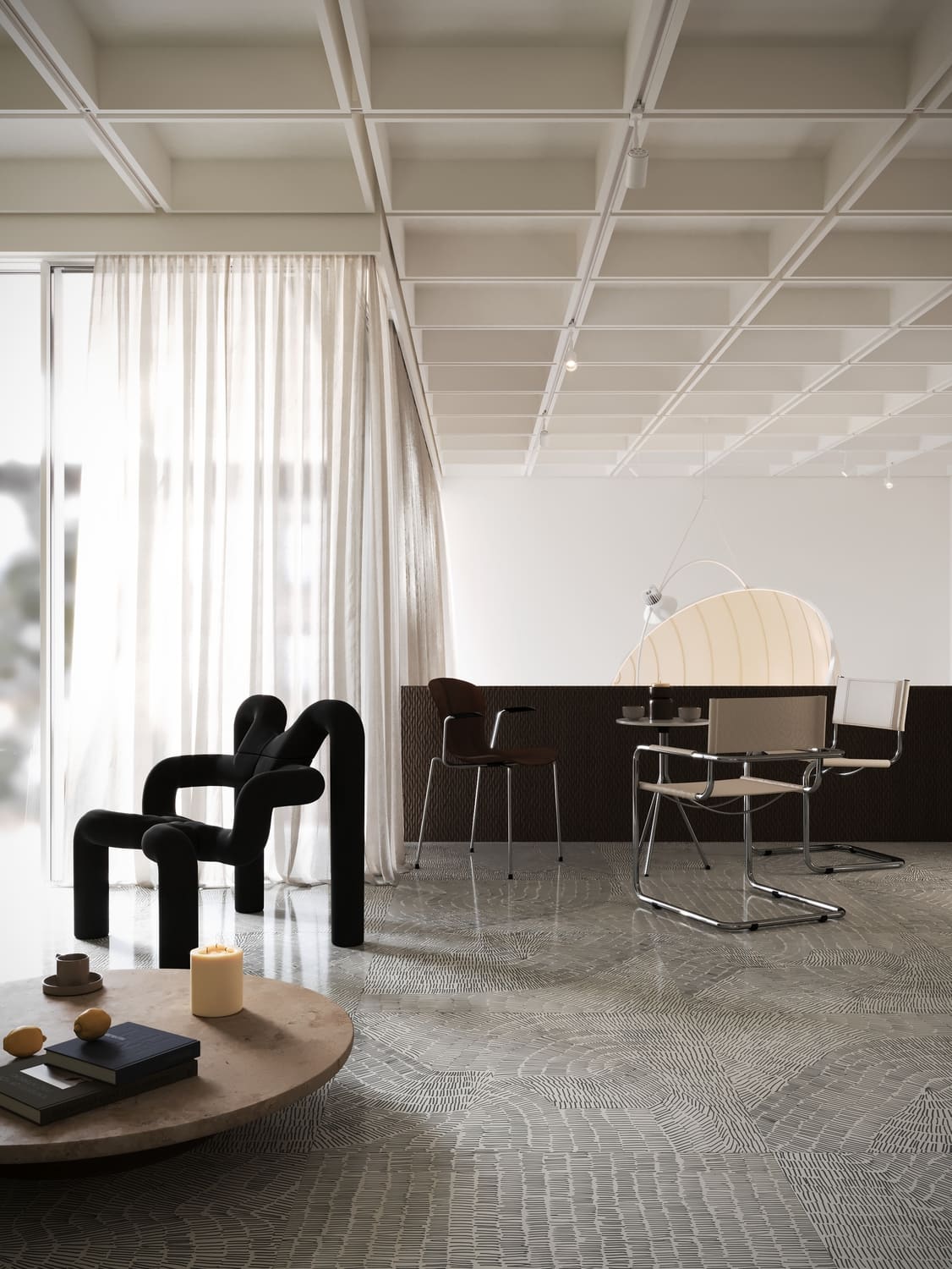 Long minimalist black bench against a softly lit panel wall reflected on a polished floor.