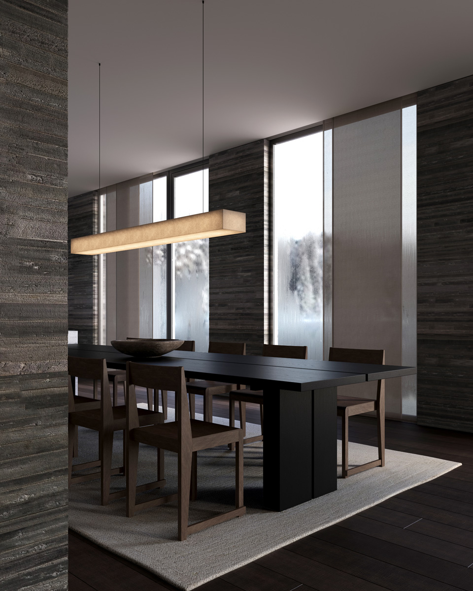 Long minimalist black bench against a softly lit panel wall reflected on a polished floor.