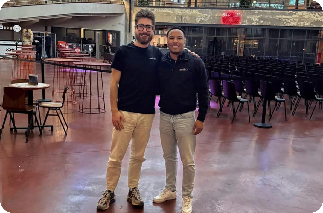 Two AuditQ team members at an event