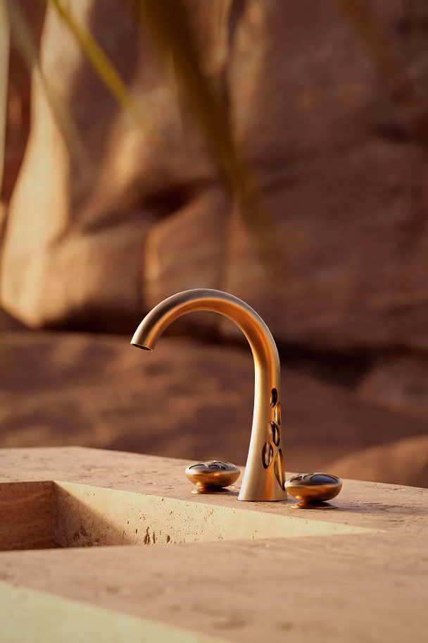 Mirari faucet close-up, desert backdrop.