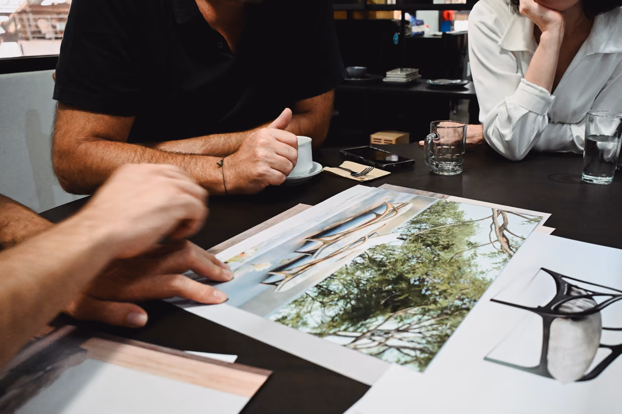 Design team reviewing sketches for the Morpho collection.