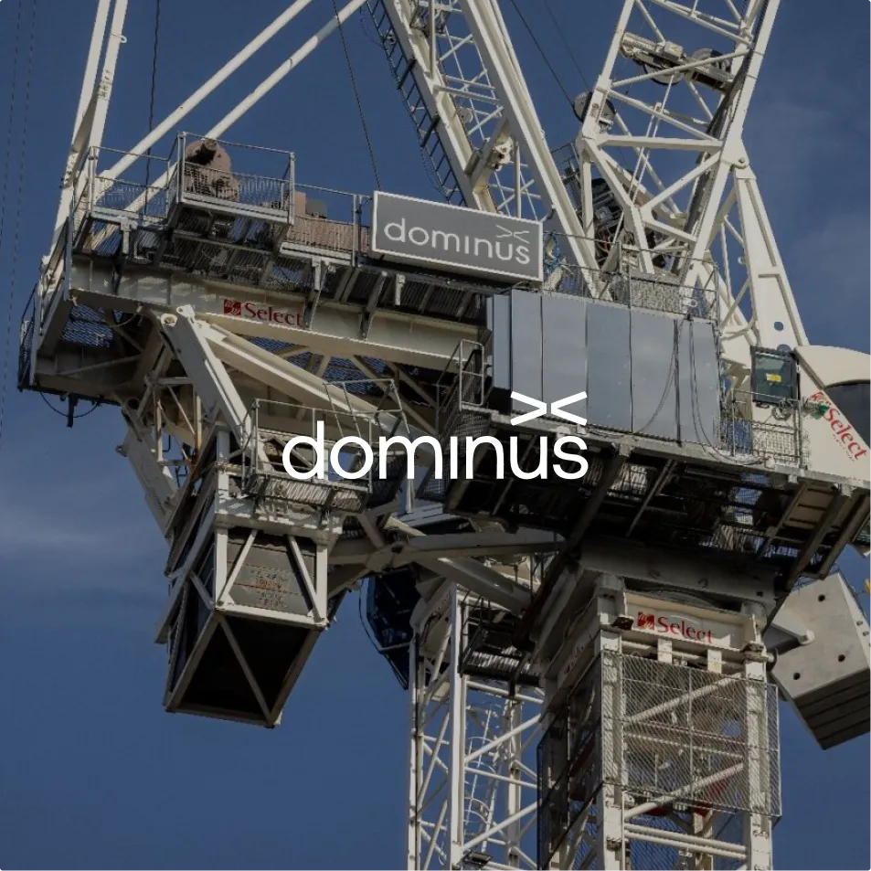 Construction crane and building structure featuring Dominus.