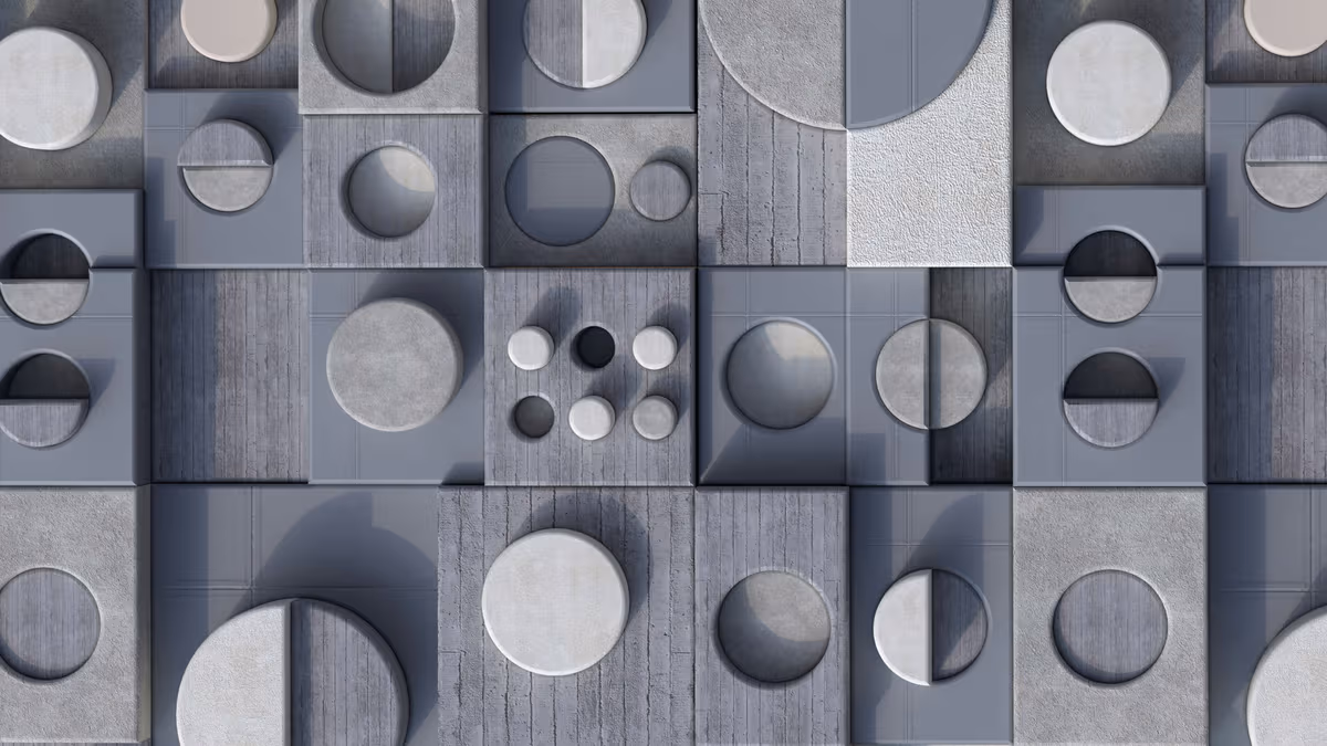 Abstract 3D wall of grey textured squares and circles with shadows and cutouts.