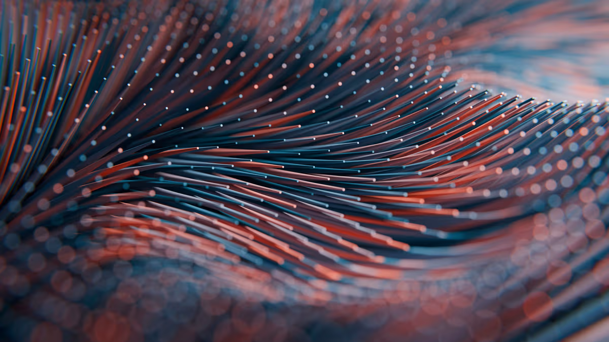 Close-up of red and blue lines with dots creating a flowing, wave-like abstract pattern.
