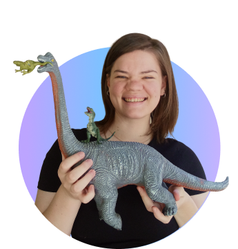 Woman with toy in hand smiling