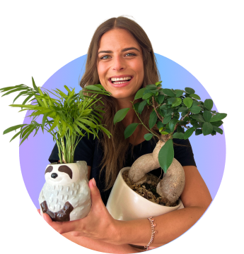 Woman smiling with plants in her hand