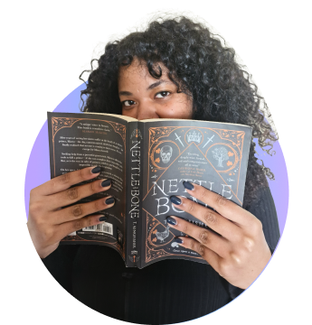 Woman holding black book