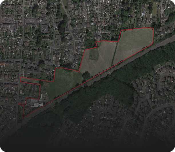 A detailed urban planning map showing a residential housing development layout with streets, houses, green spaces, trees, and labels for streets and areas.
