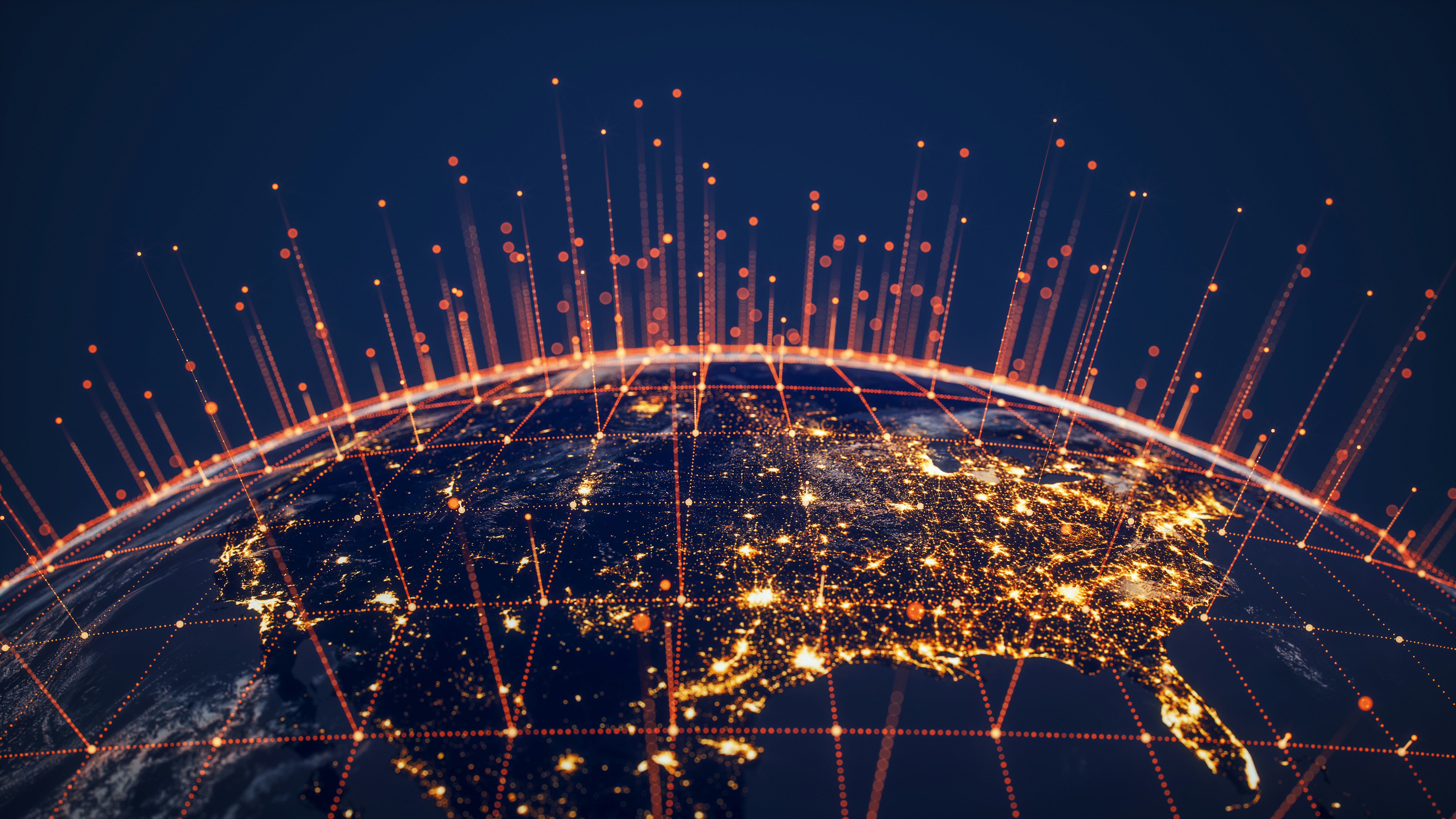 Night view of North America with glowing city lights and orange digital network lines and points.