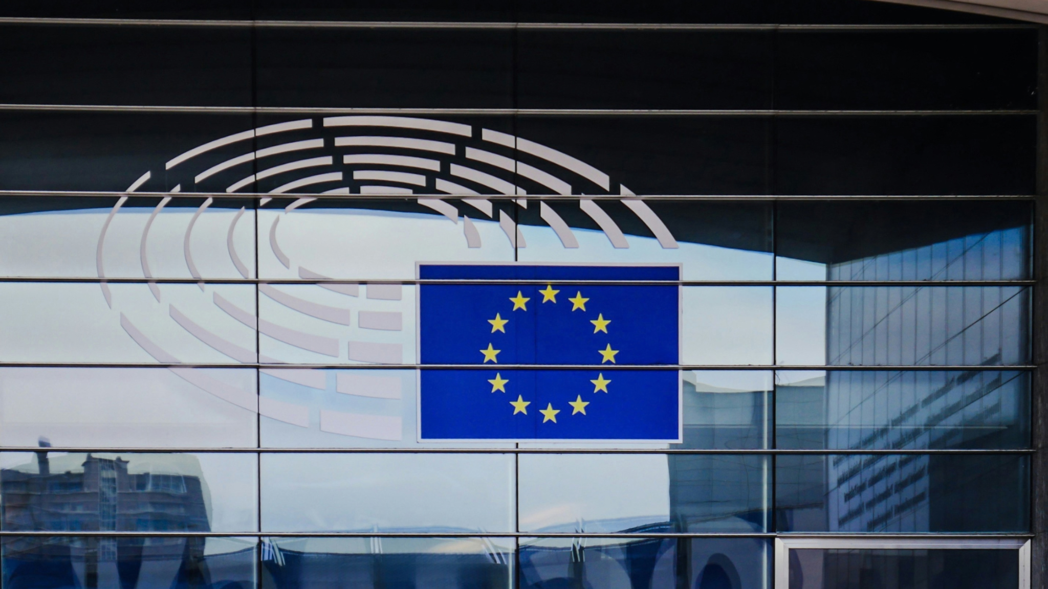 European Parliament building with the European Union flag
