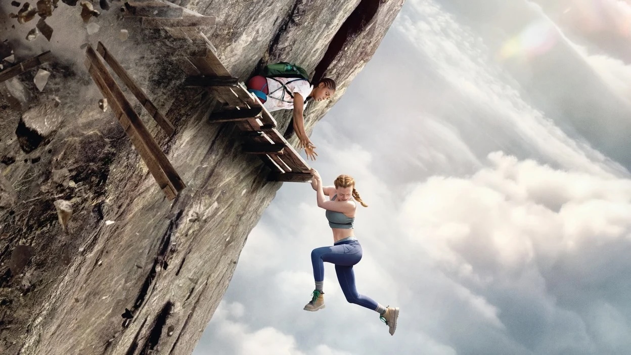 A woman clings to a platform suspended in thin air in the movie "Fall 2"
