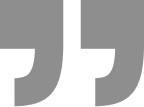 Two dark gray quotation marks on a white background representing a testimonial icon.