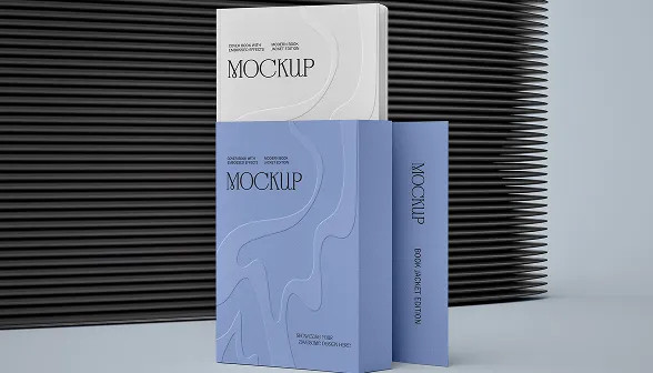 Three book mockups in white and blue with abstract designs against a black ribbed background.