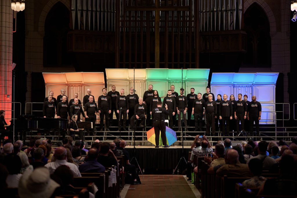 The Appalachian Equality Chorus performs inside Central Lutheran Church at GALA Choruses Festival in front of a packed audience.