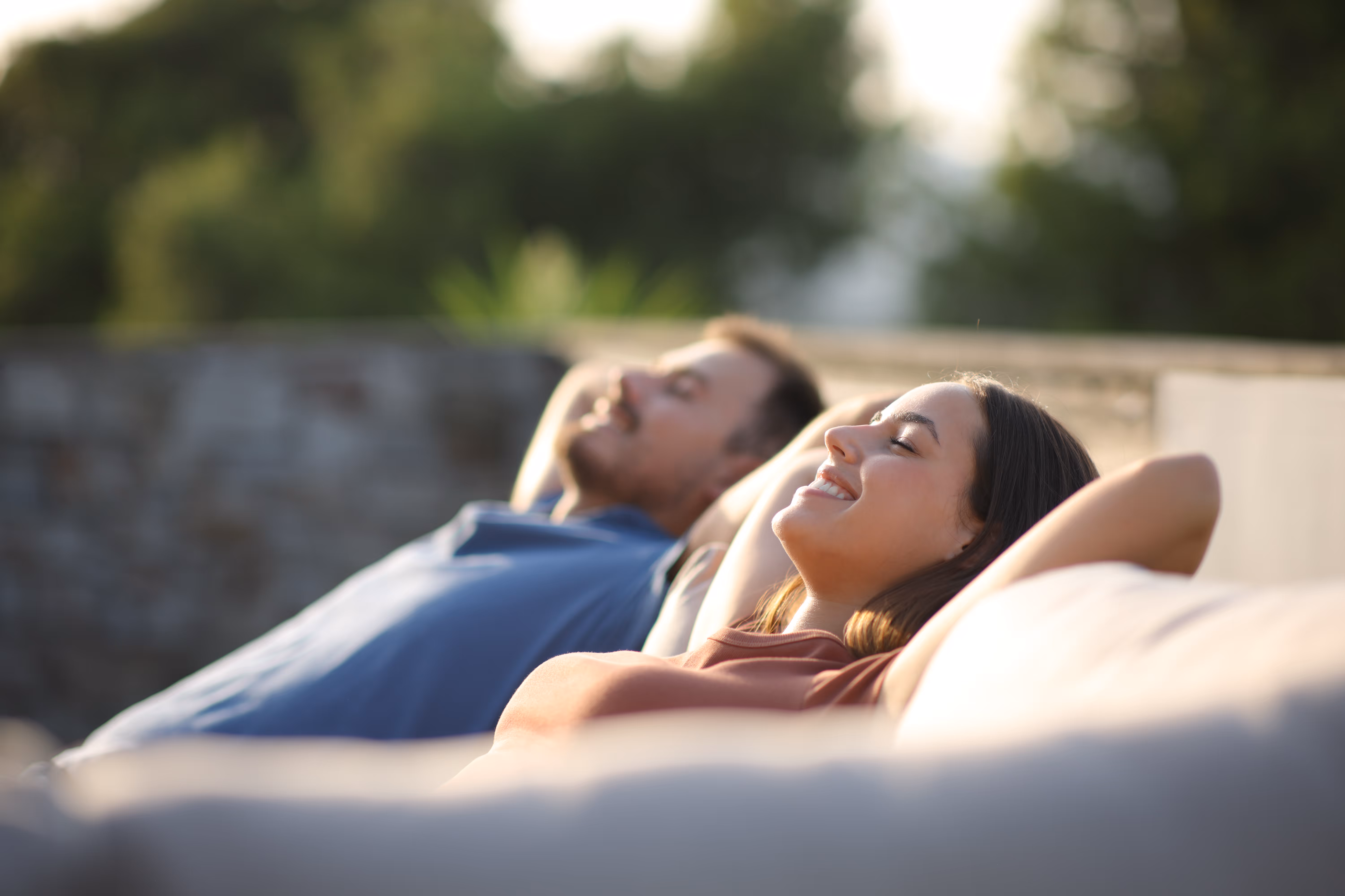 Couple relaxing outdoors stock image