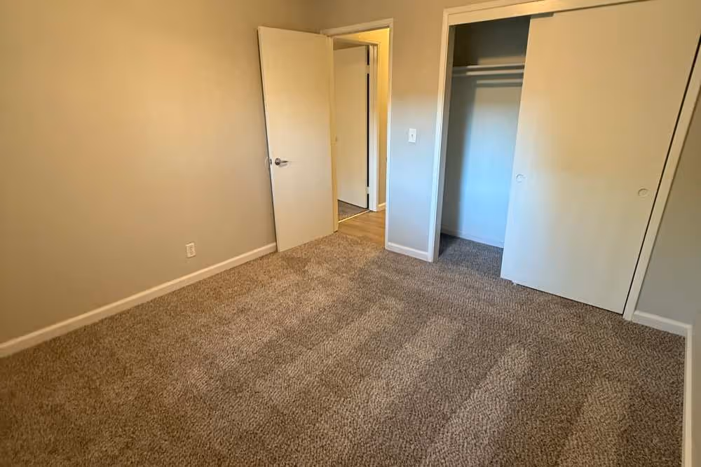 Unfurnished bedroom with carpet 