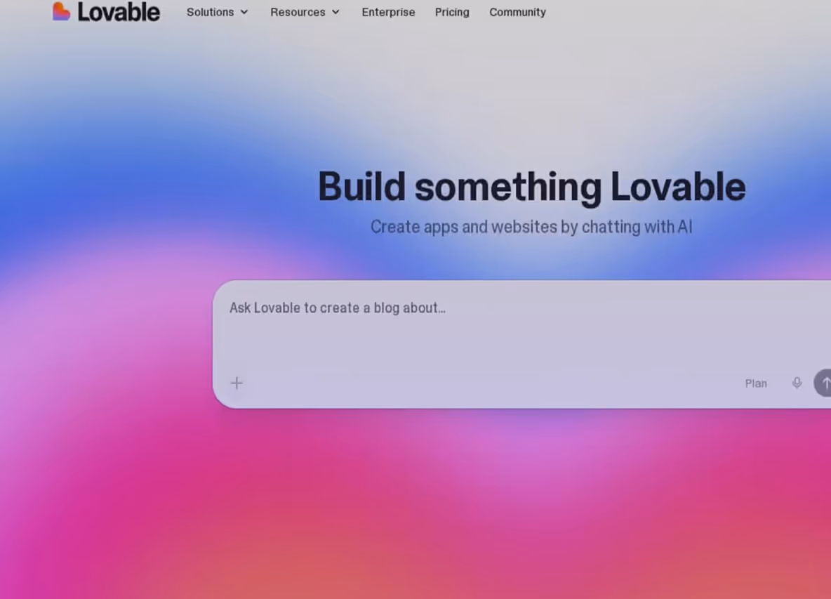 Page showing Lovable AI app builder with chat input to create blogs or websites.