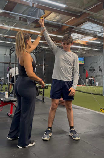 Patient working with a provider at a performance physical therapy clinic in Torrance, CA during a one-on-one sports rehabilitation session