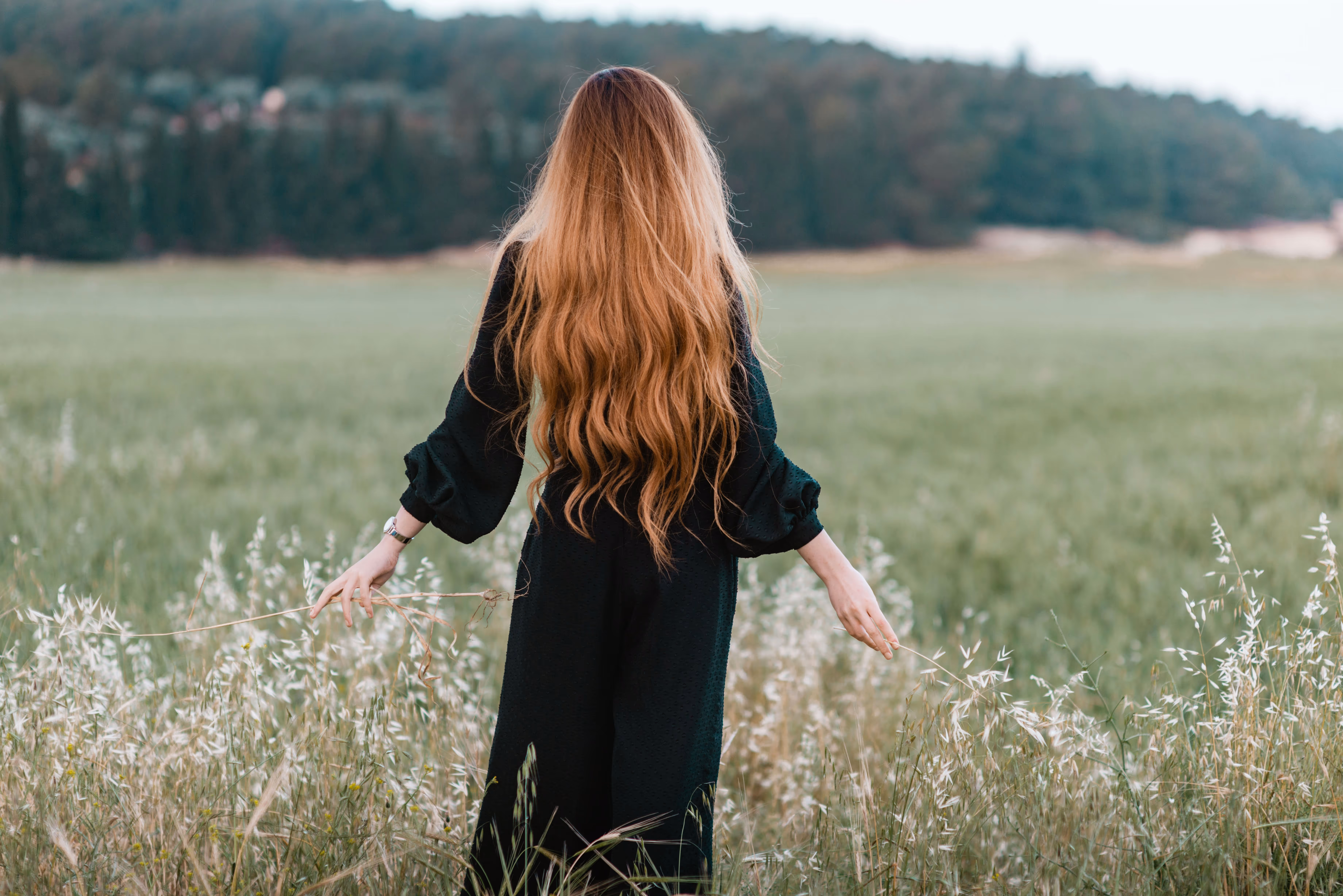 A woman in the nature with long hair